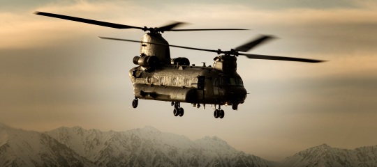 An_RAF_Chinook_helicopter_in_silhouette,_flying_over_Afghanistan._MOD_45158740.jpg